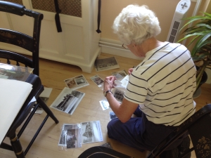 Nancy Osgood sorting photos